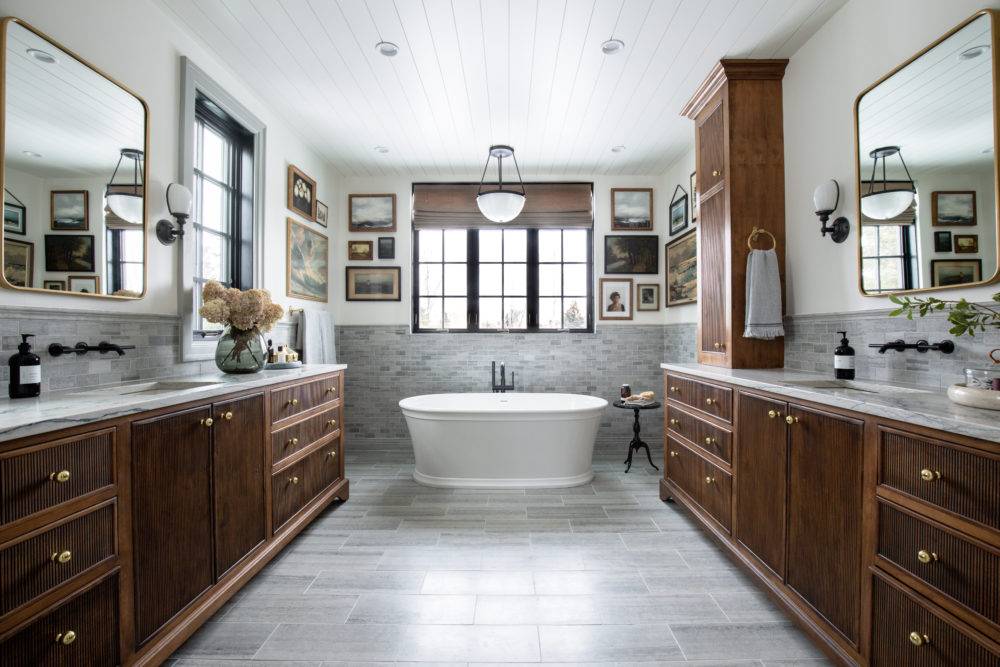 Large moody bathroom with grey marble tiled floor and walls