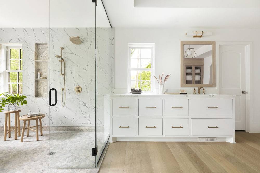 Large luxurious bathroom with marble tiled wetroom