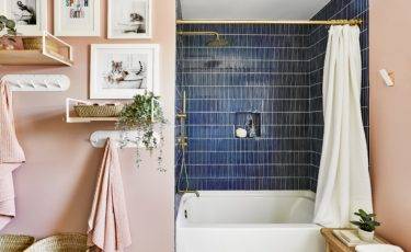 Kids bathroom with pink walls and navy blue stacked shower tile