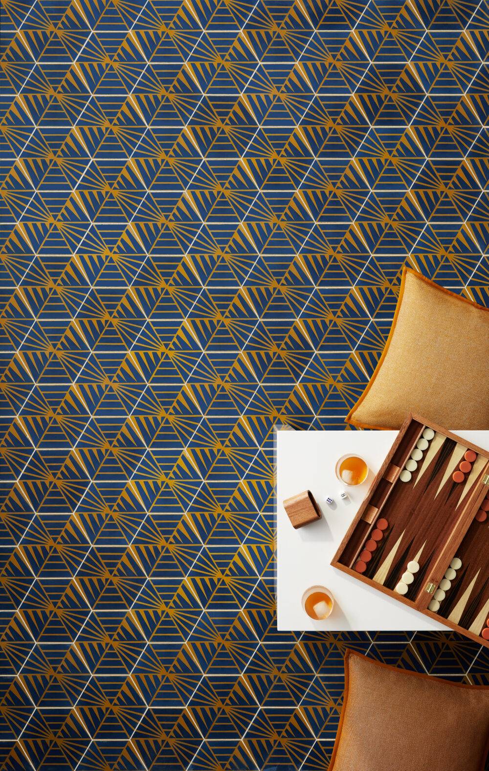 Bright blue and yellow encaustic floor tile with table with backgammon. 