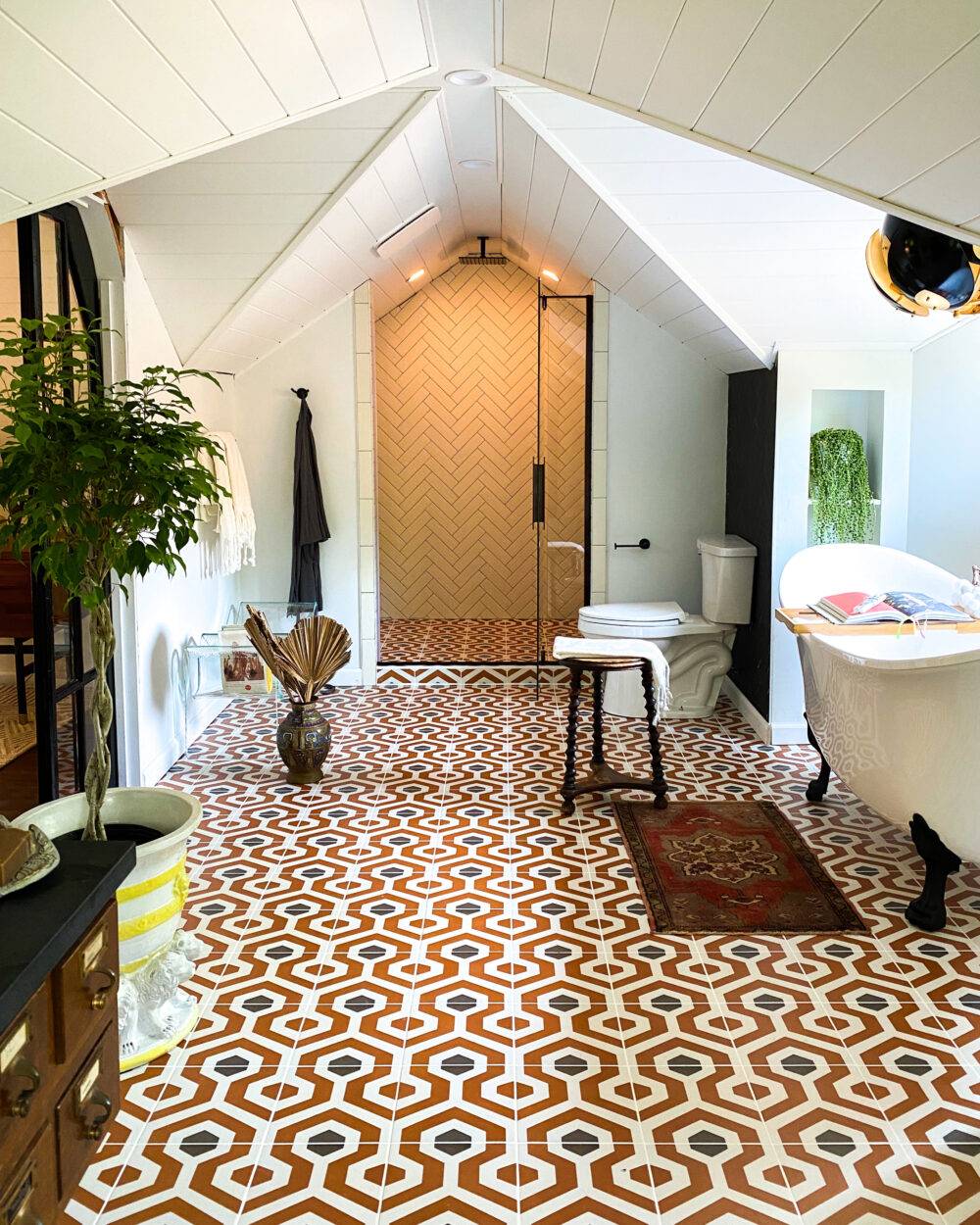 Bathroom featuring bold, geometric Artisan Tiare floor tile. 