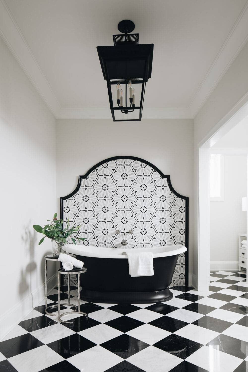 Bathroom with black and white marble checkerboard floor and Casablanca Mosaic wall tile. Featuring Hampton Carrara and Black Marquina. 